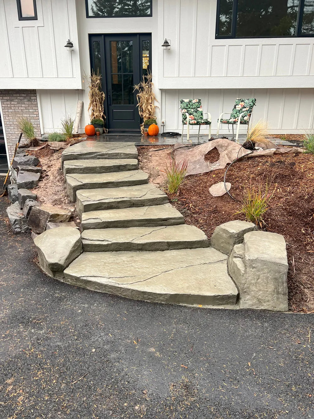 Carved stone slab steps at a front entry