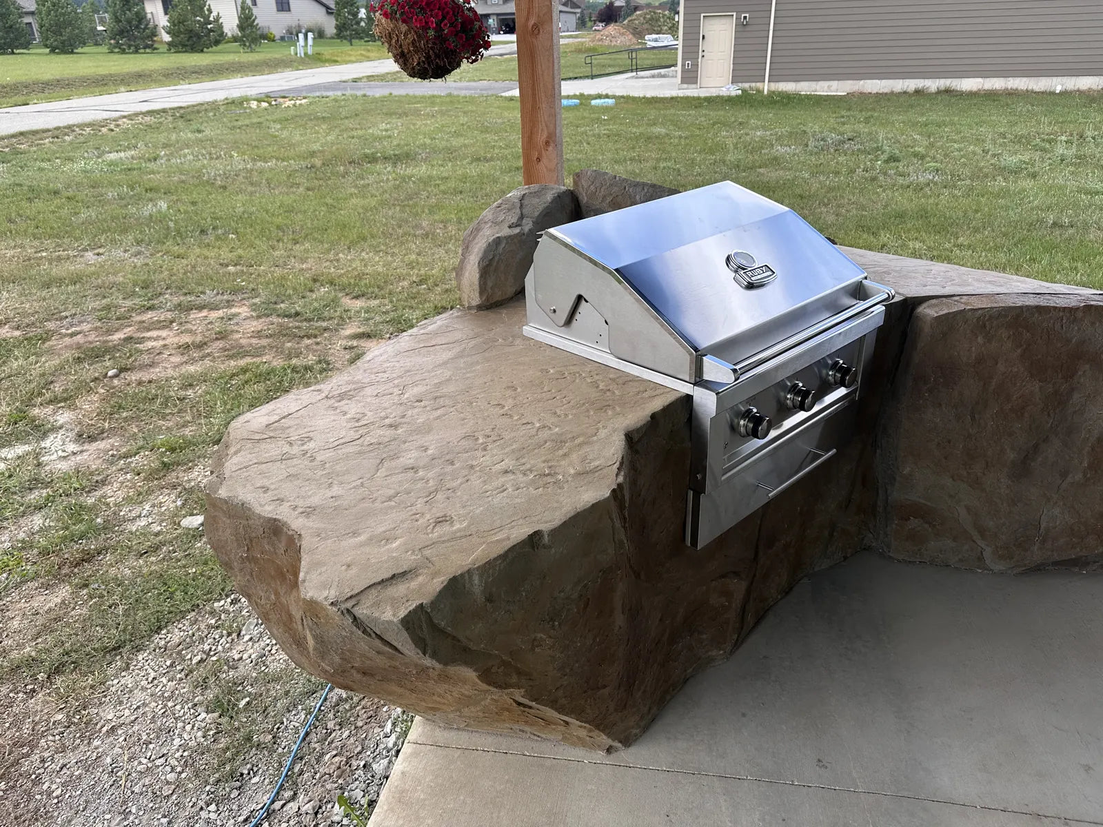 Finished carved concrete grill island from the June Vertastone training